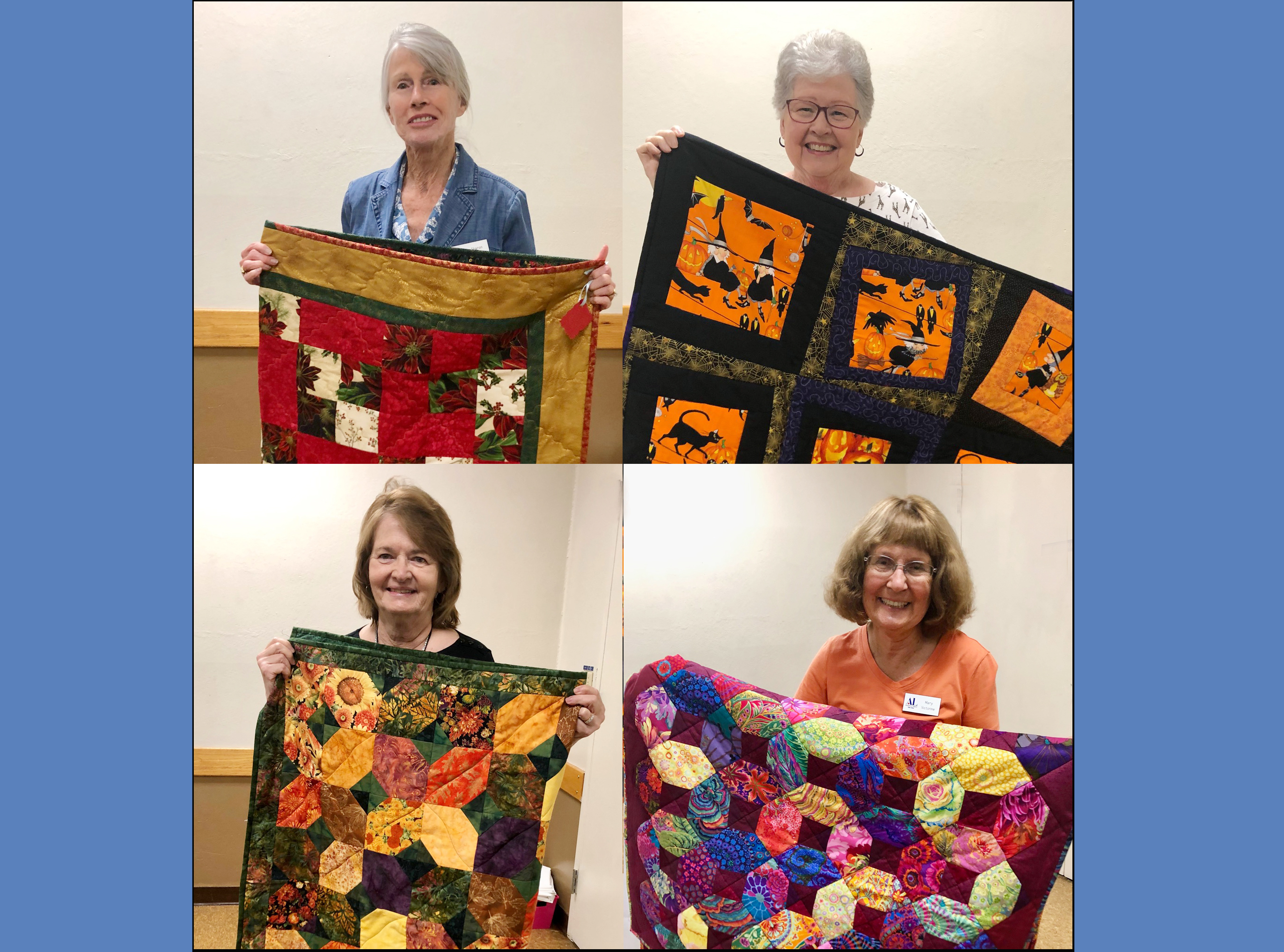 Winners of quilt fundraiser with quilts