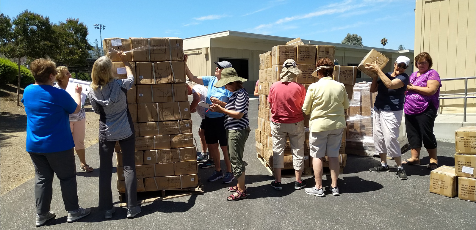Operation School Bell - unloading pallets of uniforms