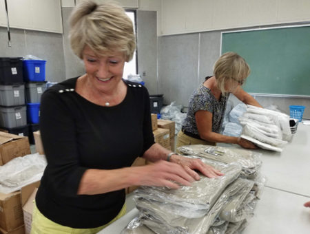 Bagging uniforms for Operation School Bell