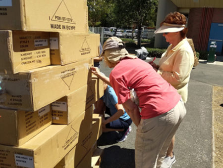 Unloading boxes of uniforms