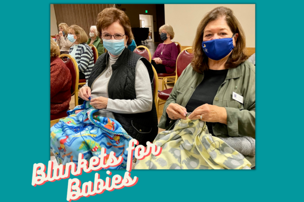 Members crocheting blankets for newborn babies