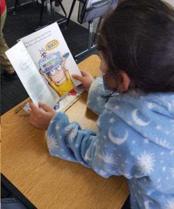 Girl Reading the Fly Guy book