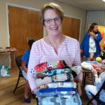 GInny holding layettes