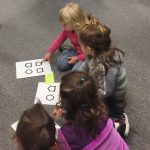 Preschoolers learning how to use the test cards