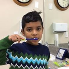 kid with toothbrush