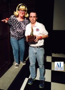 Robbie O'Brien, VP Resource Development, presenting the award to Jason Zacher at the chapter's 50th Anniversary fundraising party, "Fifty and Fabulous."