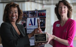 (Left to right) Carolyn Moss, Managing Director, Mid-Atlantic, State & Local Affairs, accepted the award on behalf of Dominion Resources from Pat Thompson, President of Assistance League of Northern Virginia.