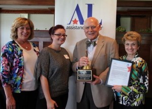 Carl Brady, recipient of the Operation School Bell Award, surrounded by his family. From left to right: daughter Kathi Burt, granddaughter Mikala Burt, Carl and wife Dorothea Brady, chapter member