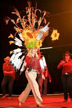 ssistance League member and past Headdress Ball co-chair Margie Arnett models a headdress in the League’s 2014 Headdress Ball. As the Rotary Club’s guest speaker on Monday, March 28, she shared that this year’s ball will be held April 30 at the National Orange Show.