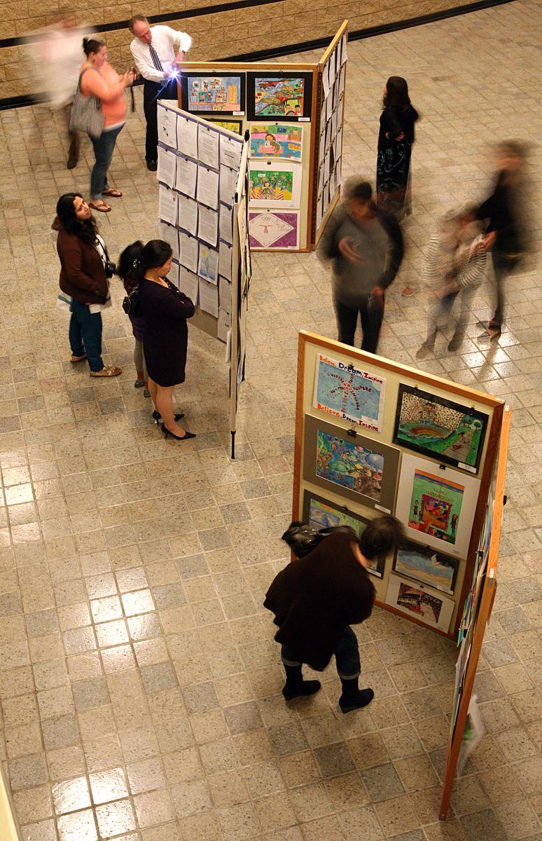 Students and parents view the student art on display in the lobby of Irvine City hall before the recognition ceremony begins Wednesday night in Irvine. The Reflections Art Program ceremony to recognize students who participated in the program was held Wednesday January 22, 2014 at the Irvine City Hall ///ADDITIONAL INFORMATION: i.0124.reflections 1-22-14 GREG ANDERSEN, CONTRIBUTING PHOTOGRAPHER