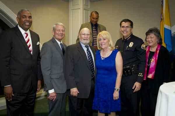 Darick Simpson, Terry Geiling, Jim and Liz Breslauer, Chief of Police Robert Luna and Assistance League representative Annette Kashiwabara. Standing in rear Dinner Co-Chair Walter Larkins. (Courtesy.)