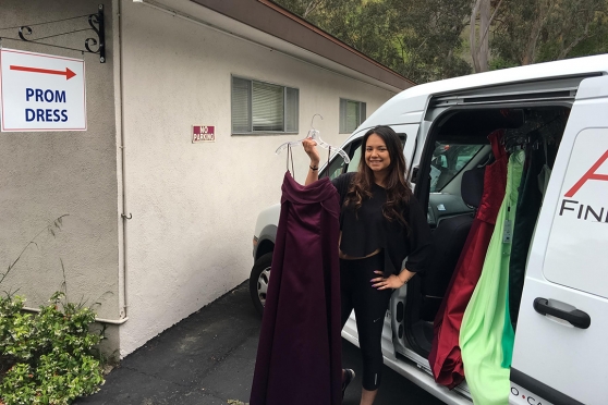 An Ablitt’s employee delivers freshly laundered prom dresses for purchase. (Ablitt’s Fine Cleaners photo)