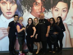 From left to right are Matthew Garza, Assistance League Vice Chairman of Marketing Kathleen McNeil, Paul Mitchell the School Admissions Leader Ashley Ratliff, Sarah Douglas, Mark Valladares, Desiry Sevilla and Jessie Solorio.