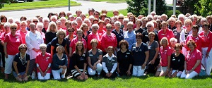 Members of Assistance League of Kansas City sporting their pearls and commemorative t-shirts at their June Chapter Meeting