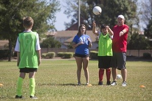 Stewart Reid, right, throws the ball to Ryan Montgomery during soccer practice in Tustin on Sunday, October 2, 2016. (Drew A. Kelley, Contributing Photographer)