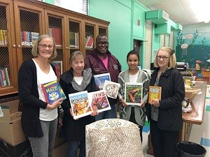 New books are presented to the Plainview Charter Academy Elementary School library. Shown from left are ALF committee member Maureen Swenson, chair Linda Gill, school Principal Kenneth Johnson, school librarian Luz Mendieta-Lopez and committee member Lyn Messner.