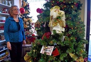 Karen Rutherford, organizational publicity chair for Assistance League of Southeastern Michigan next to a holiday home decor display at the ReSale Connection, 204 Main St. in Rochester on Dec. 9, 2016.