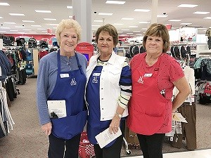 Assistance League volunteers Sue Grass, Carolyn Bray and Mary Jane Witte, left to right, get ready to help children shop for warm clothes during a recent Operation School Bell event at the El Dorado Hills Target. Courtesy photo