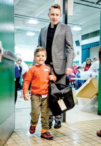 Abdulrazzaq Yousif Raad Rashid (no kidding) a kindergartener with Brian C. Hartwell Mayor of Madison Heights Michigan who helped him gather donated goods during Operation School Bell at Hiller Elementary School on 10/26/16.  The children didn't necessarily have to have a "need" to be granted a new coat, shirt, underwear, socks, toiletries, hat & gloves amongst other things from the group that put on the event and does so throughout the area.  The little guy with the long name has all of his stuff in the big bag he is carrying.