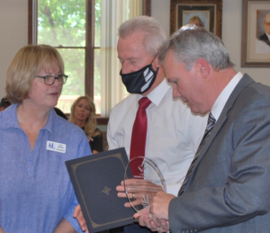 Kay Miner, Assistance League of Southern Utah President Larry Bergeson, Superintendent of Washington County School District Kelly Blake, School Board President