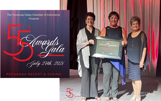 Attending the event and accepting the award on behalf of the membership were President Denise Lanier (ctr); Past Presidents and Community Ambassadors Dorcas Shaktman (l) and Electra Demos (r).